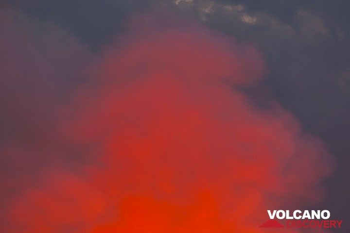 Orange steam against bluish clouds. (Photo: Tom Pfeiffer)