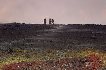 Some of the guards explore whether it is safe to reach the rim of the western crater. (Photo: Tom Pfeiffer)