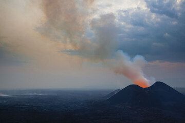 We undertook an expedition to Nyamuragira's current eruption at the new cones called Kimanura and stayed 3 nights from 22-25 January 2012. 
Thanks for granting access goes to the Virunga National Park, and to the rangers - in particular Diego - and porters who made it possible to spend time there! (Photo: Tom Pfeiffer)