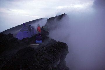 On the rim of Nyiragongo's crater, which currently is filled with steam and gas. (Photo: Tom Pfeiffer)