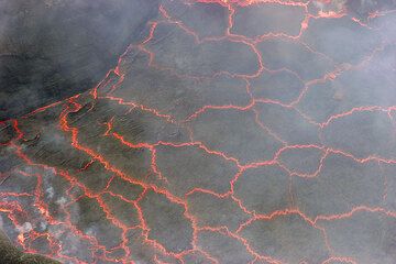 Lava lake surface with plates of darker crust floating on top of the hot interior. (Photo: Tom Pfeiffer)