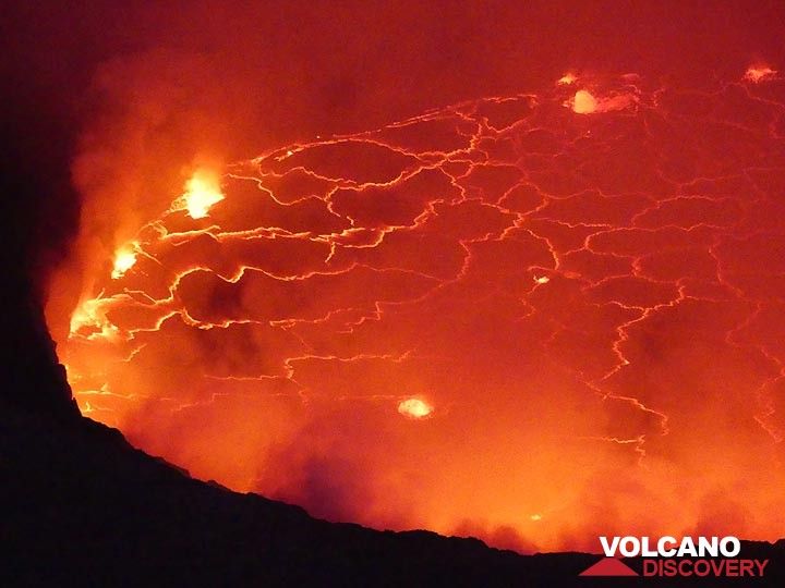 The ghostly red glow and bright yellow fracture pattern and gas bubble explosions of the lava lake in the evening of 8 June 2017.  (Photo: Ingrid Smet)