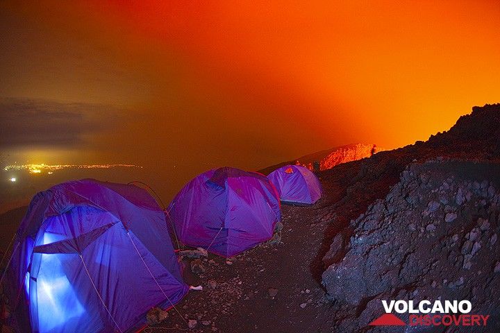 Time to wake up and enjoy the last hour of darkness before sunrise! As usual, Gilles is already up before all others and standing at the crater rim behind, to watch the lava lake. (Photo: Tom Pfeiffer)