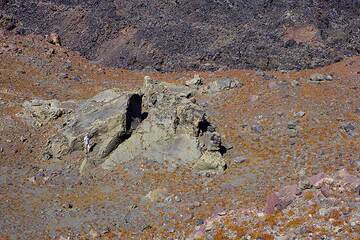 Giant (about 15 m across) breadcrust bomb on Nea Kameni from the 1866-70 eruption of Georgios lava dome. Note the person for scale. (Photo: Tom Pfeiffer)