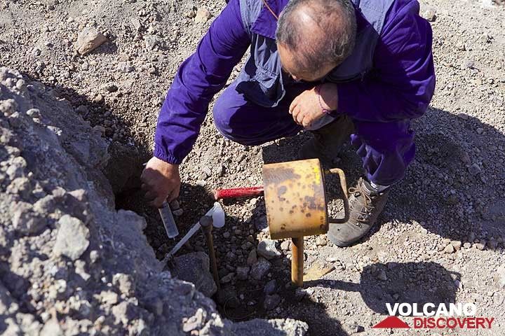 Scientist taking a gas sample from a fumarole at Nea Kameni (Photo: Tom Pfeiffer)