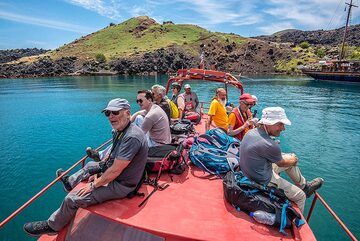 Enjoying the calm sea on the roof of the boat. (Photo: Tom Pfeiffer)