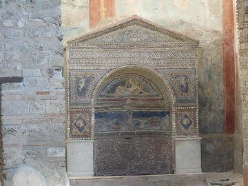 Despite the destructive power of the eruption, some valuable artifacts were preserved in the larger villas of Pompeii such as this intricate mosaic altar. (Photo: Ingrid Smet)