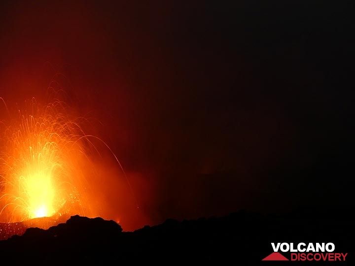 A Strombolian explosion occurs when gas rising up in the lava conduit system collects in a large bubble which eventually bursts through the surface and entrails red hot lava. (Photo: Ingrid Smet)