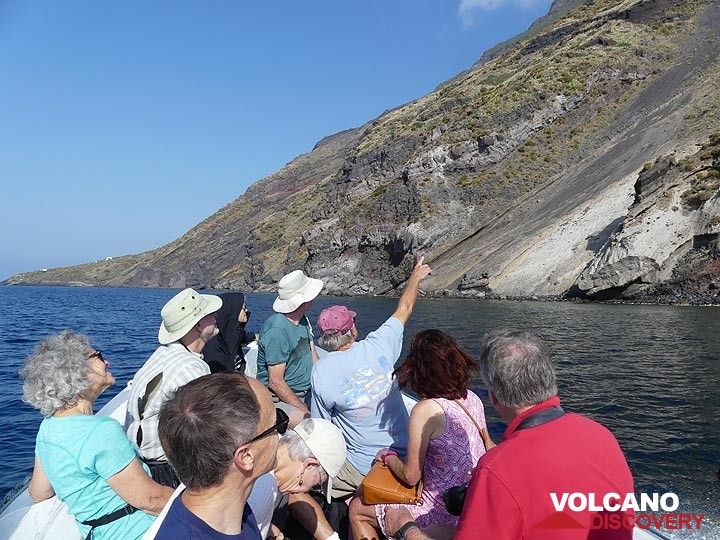 Observing and discussing the different volcanic deposits and textures visible along the island's coast as we sail around it. (Photo: Ingrid Smet)