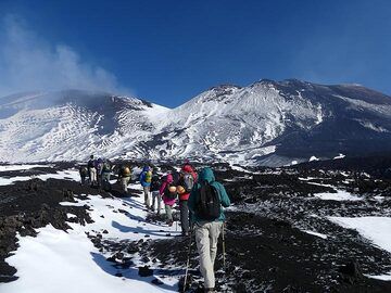 With our private mountain guide we start our hike up to the summit of the Bocca Nuovo - Voragine crater complex. (Photo: Ingrid Smet)