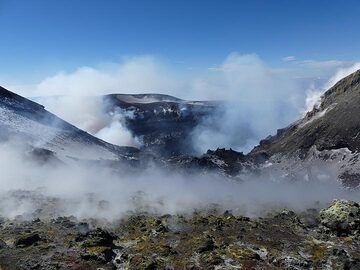 View from the saddle between the NE and Voragine craters to towards the latter, with the Bocca Nuova crater in the background. (Photo: Ingrid Smet)