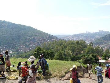 Day 2 - Having left Kigali: looking back onto the capital in the background and a small local market on the foreground (Photo: Ingrid Smet)