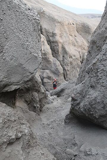 Rain falls have cut deep canyon into the several meters-thick ash deposits that were deposited after the collapse in Dec 2018. (Photo: AndreyNikiforov)