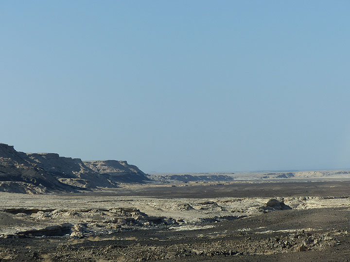 DAY 3: From Logia to Afrera salt lake - continuing down into the Danakil below sea level, the lava grind desert starts to be covered by bright deposits... (Photo: Ingrid)