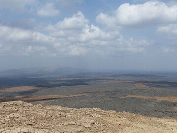 DAYS 5-6-7: Erta Ale - View from the Erta Ale caldera rim across the seemingly peaceful area of shield volcanoes that form the East African rift. (Photo: Ingrid)