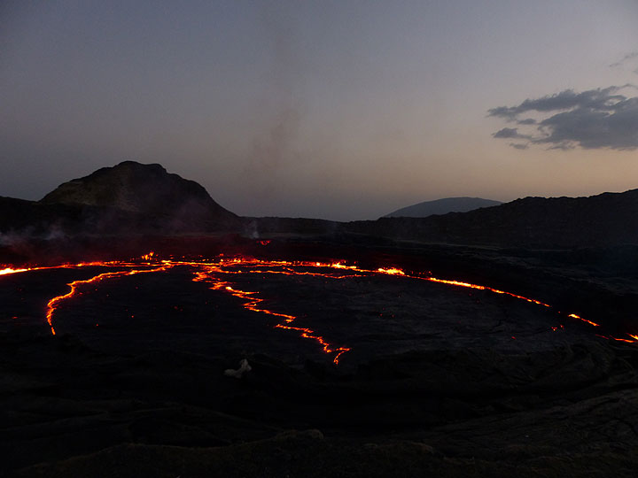 DAYS 5-6-7: Erta Ale - As the daylight slowly fades away, the red-hot glow along the edges and zigzag cracks of the lava lake become more visible. (Photo: Ingrid)