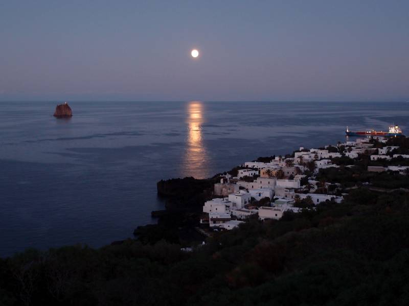 Full moon illuminating Stromboli village and Strombolicchio islet, Italy (Photo: Janka)