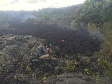 Pause in activity after the surge is over - a flat 'a'a flow tongue has reached the base of the pali. (Photo: Michael Dalton)