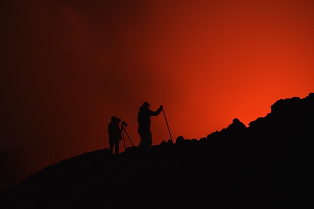 Silhouettes of visitors at the lava lake (Photo: Michael Wareham)