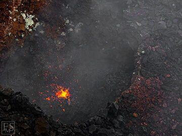 Lava spattering up from one of the small active vents on the edge of the south crater (Erta Ale summit caldera) (c)