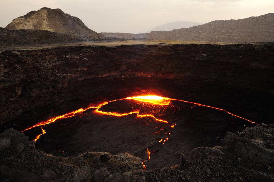 The active lava lake of Erta Ale starts glowing with the falling of the night. (Photo: shinkov)