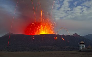 Strombolian eruption at Mt. Bromo volcano in Feb 2011 - this photo was selected for the 2012 IAVCEI volcano calendar. (Photo: Tom Pfeiffer)