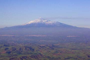 Snow-covered Etna volcano seen from the SW from the airpland on 30 April 2012 (Photo: Tom Pfeiffer)