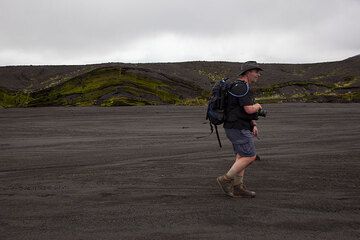 Hiking along one of the major flash flood beds cutting through the ash deposits of the caldera.  (Photo: Tom Pfeiffer)