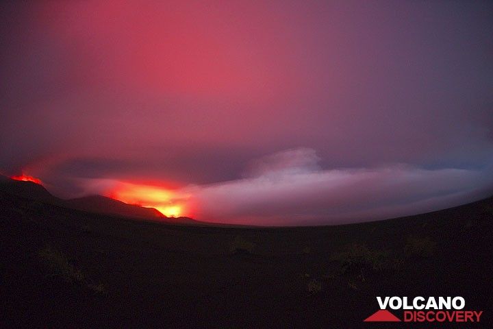 Thunderstorms are frequent above Ambrym. Here, the lava lakes in the craters illuminate a rain cloud hovering above the caldera. (Photo: Tom Pfeiffer)