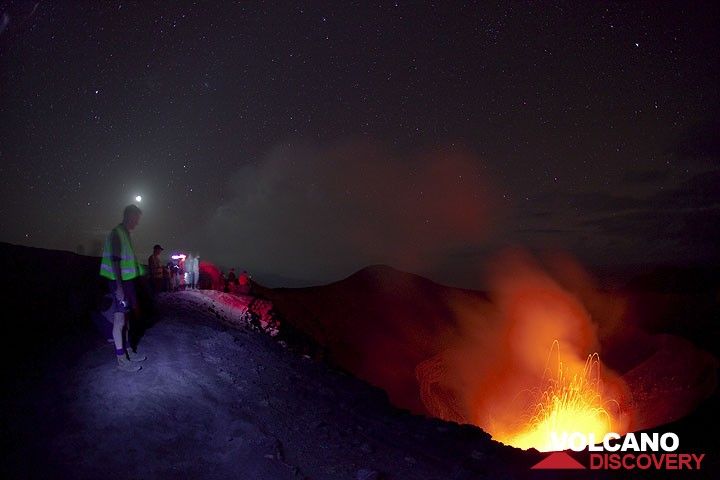 Volcano watchers on the rim of Yasur, above the active craters at night. (Photo: Tom Pfeiffer)