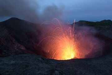 Strombolian eruption from the south crater at dusk. (Photo: Tom Pfeiffer)