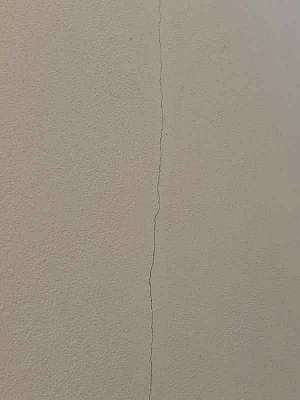 Cracks on the side of my house (public domain)
