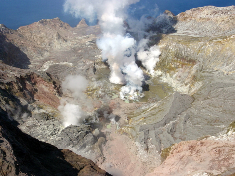 View of active vent area from the summit on 4 October 2013. Note how the active vent area in the centre has moved to the left and the pinky-red landslide debris in the foreground. (GeoNet)