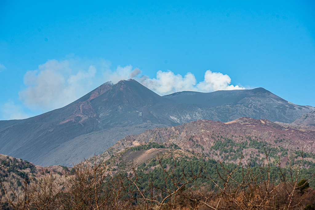 Etna's summit region seen from the east this morning. New SE crater to the left, and a small ash plume emitted from the Voragine (center) is visible.