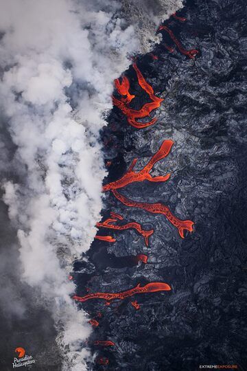 : This image taken during an early morning overflight on Sunday, June 24, 2018 shows dozens of rivulets of lava entering the sea at Kapoho, creating multiple active ocean entries with laze plumes. (Bruce Omori, Extreme Exposure Fine Art Gallery)