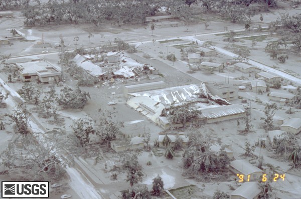 Aerial view of part of Clark Air Base showing buildings and vegetation damaged by tephra (ash) fall of 15 June, 1991. U.S. Geological Survey Photograph taken on June 24, 1991, by Willie Scott.