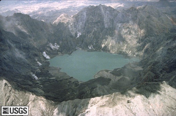 Aerial view west across Pinatubo caldera showing fumaroles and crater lake. U.S. Geological Survey Photograph taken on May 18, 1992, by Willie Scott.