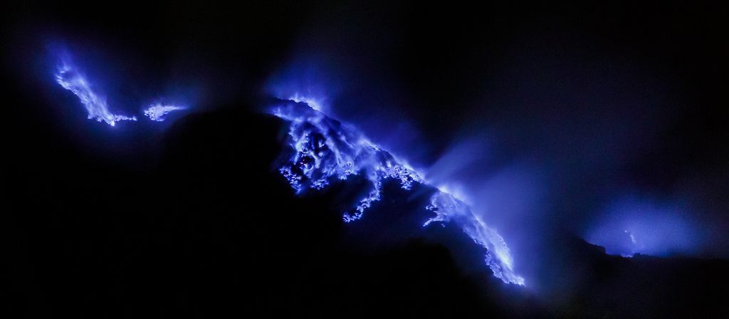 Blue fire (burning sulfur gas) at Kawah Ijen. Photo credit: Thomas Fuhrmann, Wikipedia.