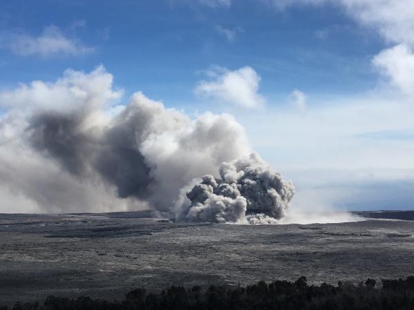 A pulse of ash rises from Halema‘uma‘u as part of semi-continuous emissions at Kīlauea's summit during Wednesday 23 May. Ash can be seen falling from the plume as it is blown downwind in this image, taken around 3:28 p.m. HST. USGS photo by I. Johanson.