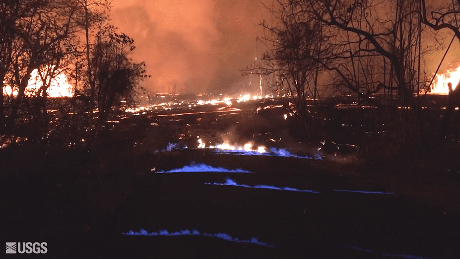 Blue burning flames of methane gas was observed in the cracks on Kahukai Street close to the active fissure,  during the night from 22 to 23 May 2018. When lava buries plants and shrubs, methane gas is produced as a byproduct of burning vegetation. (HVO/USGS)