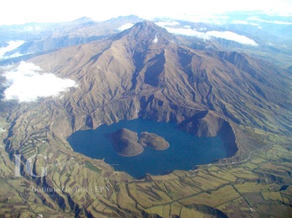 Lava domes in the lake of the active caldera, with much older and extinct Cotacachi stratovolcano in background. Credit: P. Ramós, IGEPN