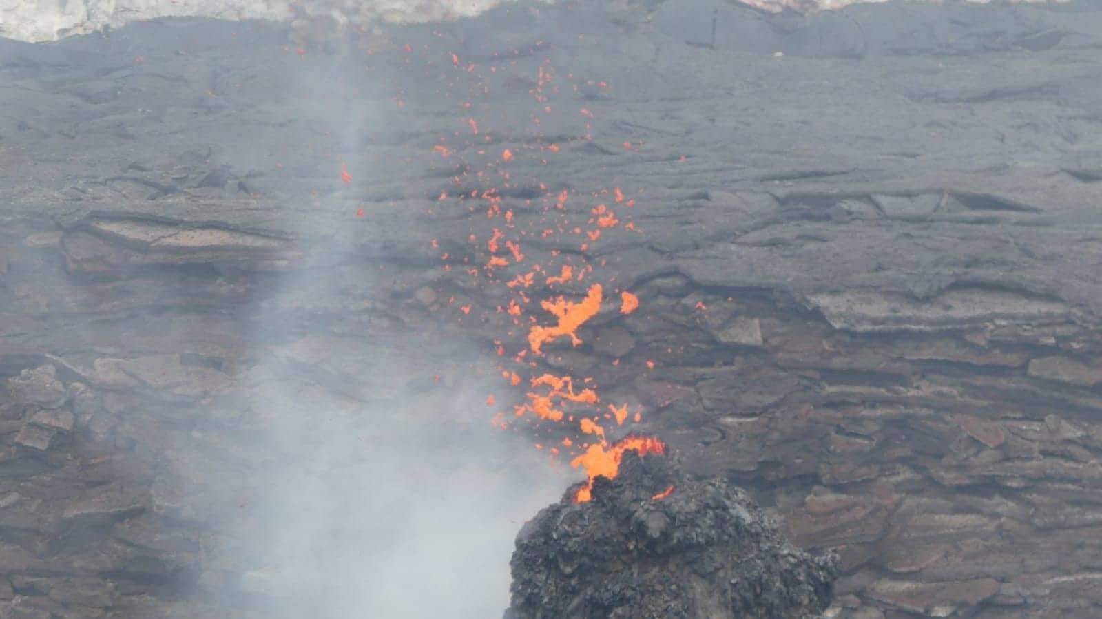 The lava spatters through the hornito formed in the northern pit crater (image: Enku Mulugeta)