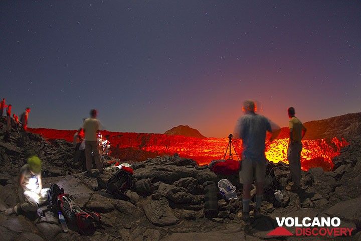 Nighttime observation of Erta Ale's active lava lake under the stars and red glow (Tom Pfeiffer)