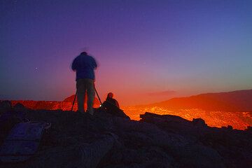 Silhouette of photographer at the rim of the lava lake