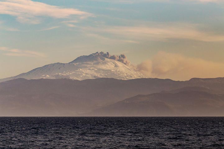 Etna erupting ash from NE crater as seen last evening from Lipari (!) during extremely clear weather (image: Emanuela Carone / VolcanoDiscovery Italia)