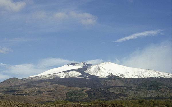 Snow-covered Etna volcano with the fresh lava flows from 2002/03