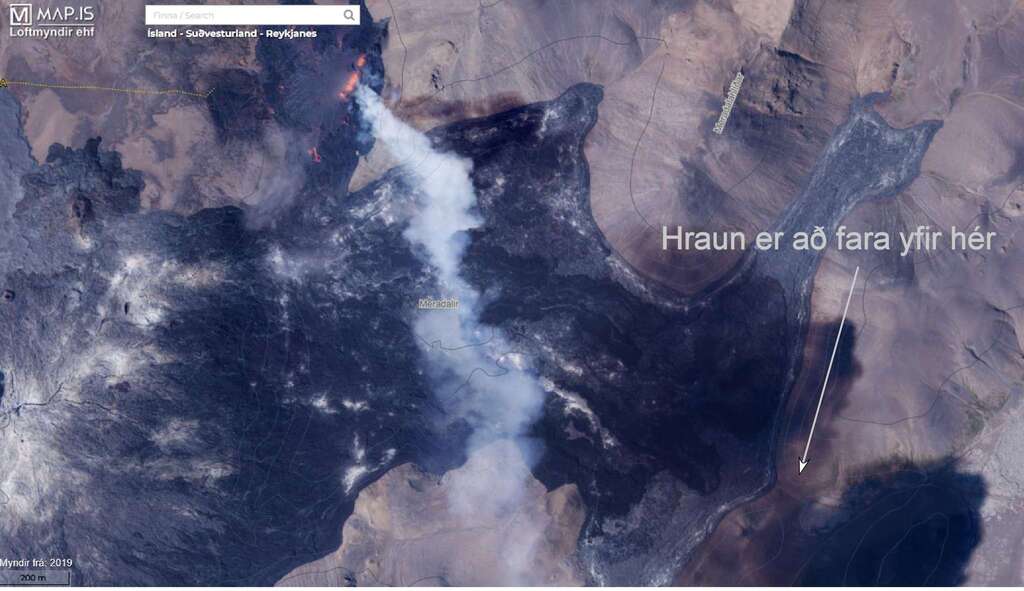 Satellite image of the site showing the easternmost part of the lava close to overflow to Suðurstrandavegi valley (arrow) (image: map.is)