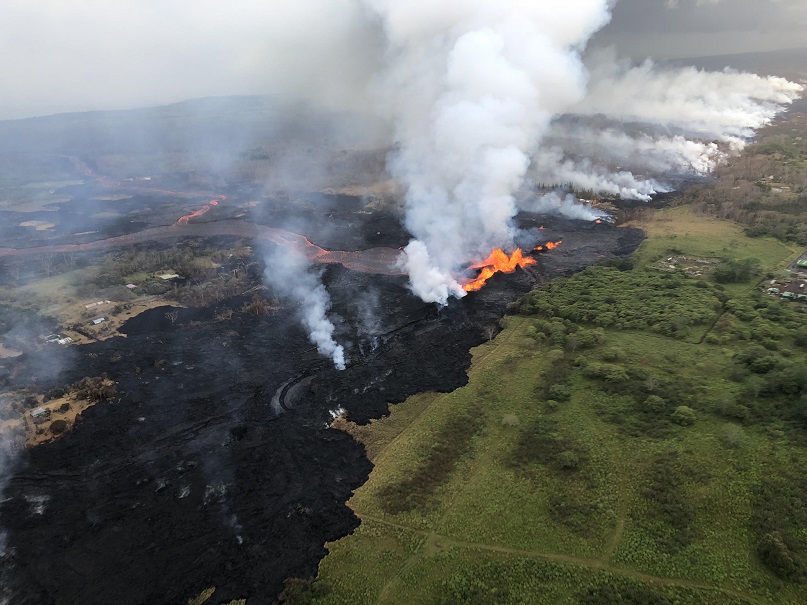 Aerial view of erupting fissure 22 and lava channels flowing southward from the fissure during an early morning overflight on 21 May. ( Photo :  Volcano Helicopters)