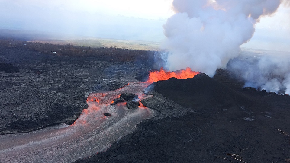 The three closely spaced lava fountains at fissure 8 are building a cinder-and-spatter cone around the erupting vent through downwind accumulation of lava fragments falling from the fountains. (HVO/USGS)