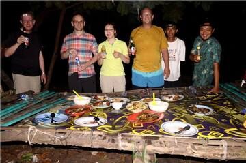 Freshly prepared local dinner during camping on Krakatau